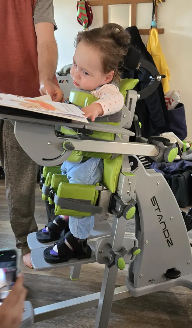 Charli working in her stander.